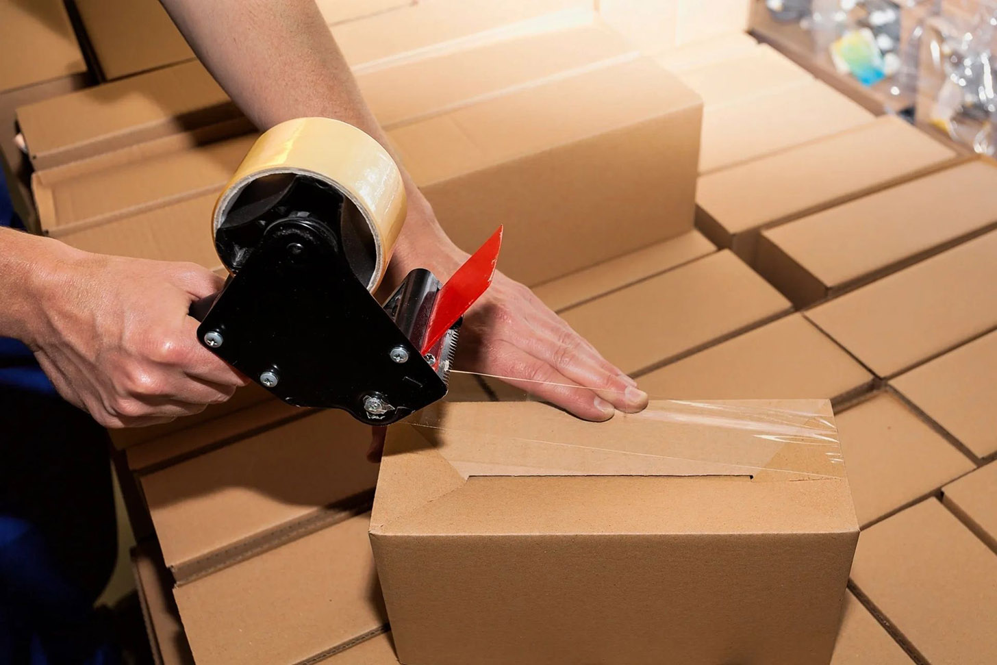 Order fulfilment solutions in the uk image of a box being sealed